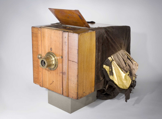 A photographer using wet collodion technique during the development of photography